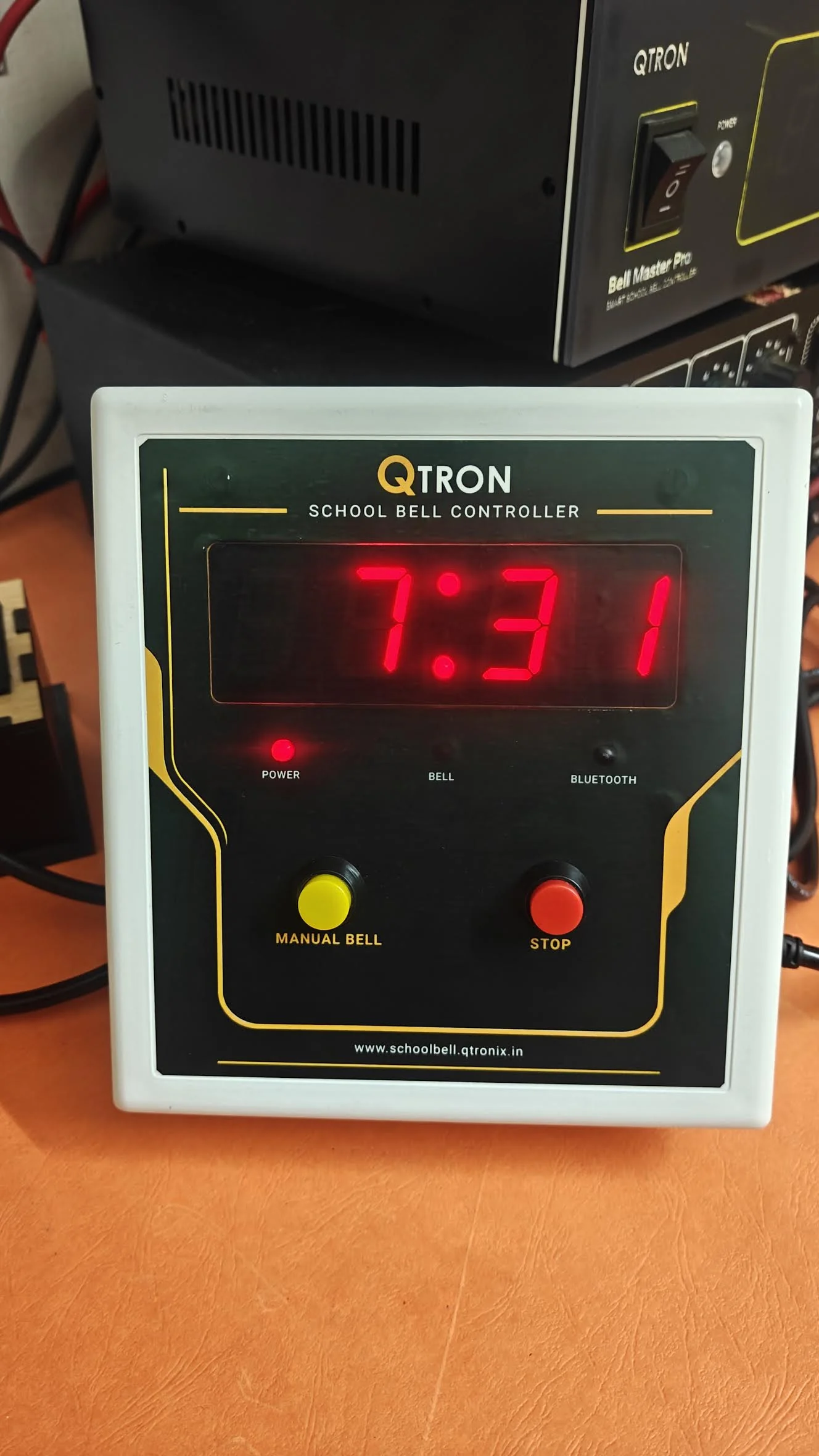 Actual front photograph of the QTRON controller with its clock running